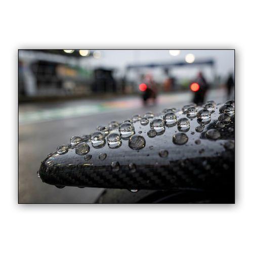 The Tension of Speed: Rain on Carbon Fiber wall art poster
